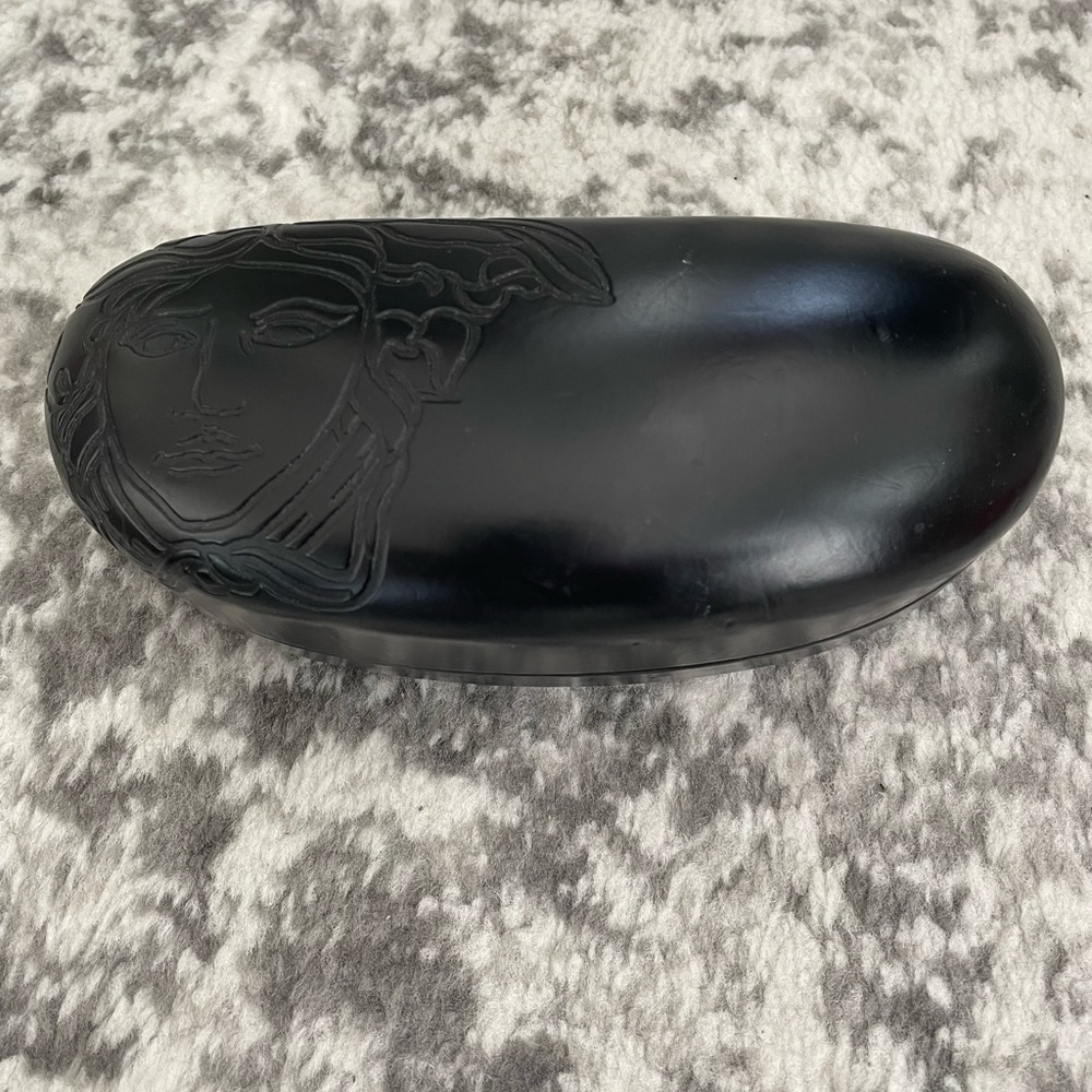 FREE with $20 + purchase. Versace glasses case.
